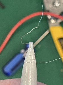 Make one of the loops tighter using a pencil Figure