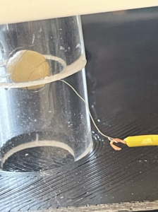 Slide tubes into the clamps and hook wires (solder after hooked)