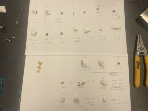 Testing the different lengths of wire using hooked connections (recorded the length of wire, time to pop, and current used)